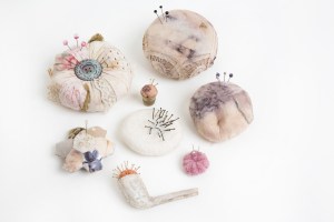 image of decorative pincushions arranged for exhibition