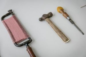 Decorated saw, hammer and screwdriver