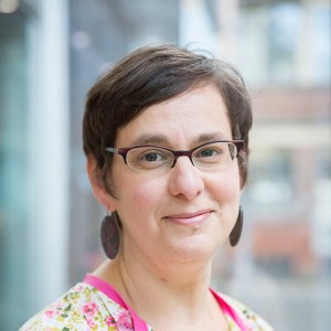 head and shoulders image of Ruth Singer, white woman with short dark hair and glasses